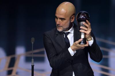 Manchester City coach Pep Guardiola receives The Best FIFA Men's Coach award during the Best FIFA Football Awards 2023 ceremony in London on January 15, 2024.  (Photo by Adrian DENNIS  /  AFP)