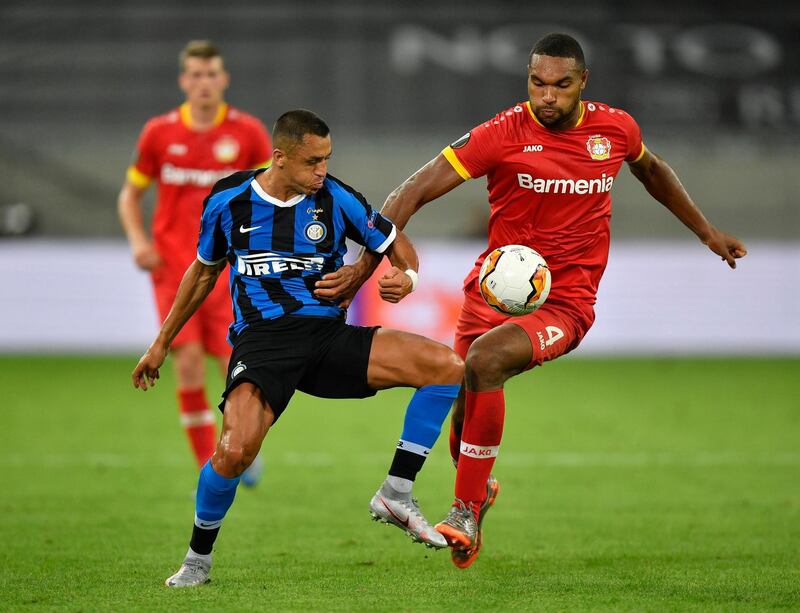 Inter substitute Alexis Sanchez is challenged by Bayer Leverkusen's Jonathan Tah. Reuters