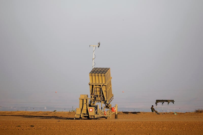 FILE PHOTO: An Israeli soldier keeps watch by an Iron Dome rocket interceptor battery deployed near central Gaza Strip, southern Israel October 31, 2017. REUTERS/Amir Cohen/File Photo