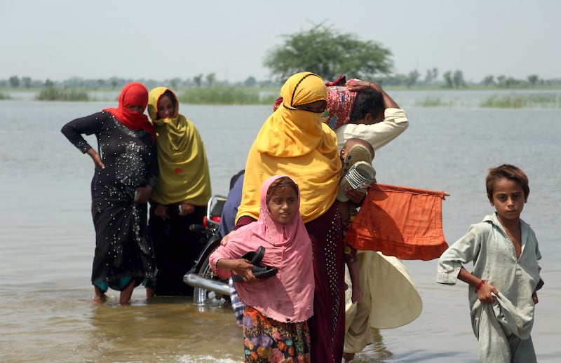 People affected by floods move to higher ground in Dadu district, Sindh province, Pakistan. EPA