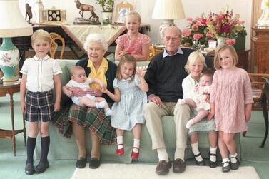 An undated handout picture released by Kensington Palace on April 14, 2021 shows Britain's Queen Elizabeth II and Britain's Prince Philip, Duke of Edinburgh with their great grandchildren. Pictured (L-R) are Britain's Prince George of Cambridge, Britain's Prince Louis of Cambridge being held by Britain's Queen Elizabeth II, Savannah Phillips (standing at rear), Britain's Princess Charlotte of Cambridge, Britain's Prince Philip, Duke of Edinburgh, Isla Phillips holding Lena Tindall, and Mia Tindall. (Photo by THE DUCHESS OF CAMBRIDGE / KENSINGTON PALACE / AFP) / RESTRICTED TO EDITORIAL USE - MANDATORY CREDIT "AFP PHOTO / KENSINGTON PALACE / DUCHESS OF CAMBRIDGE" - NO MARKETING - NO ADVERTISING CAMPAIGNS - NO COMMERCIAL USE - RESTRICTED TO SUBSCRIPTION USE - STRICTLY NO SALES - DISTRIBUTED AS A SERVICE TO CLIENTS - NOT FOR USE AFTER DECEMBER 31, 2021. /