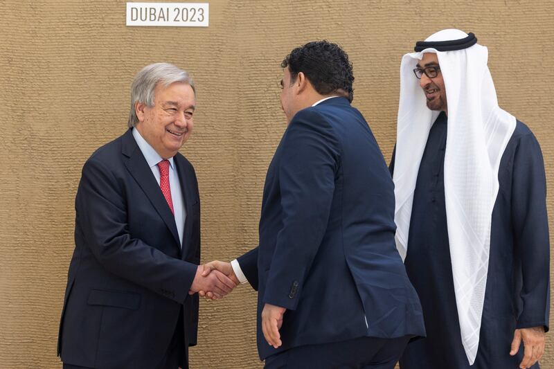 President Sheikh Mohamed looks on as Mohamed Al Menfi, Libyan Presidential Council Chief, shakes hands with the UN Secretary General. Ryan Carter /  UAE Presidential Court