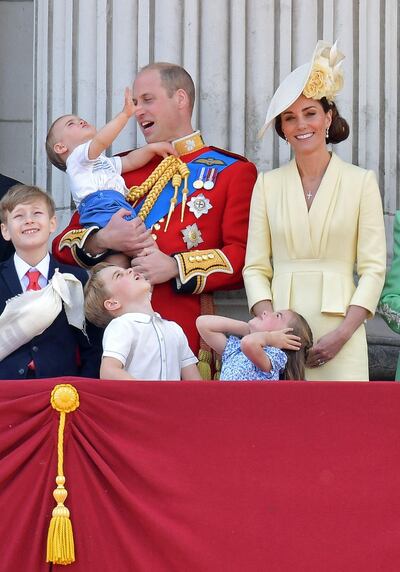 (L-R) Albert Windsor, Britain's Prince William, Duke of Cambridge holding Prince Louis, Prince George, Princess Charlotte and Britain's Catherine, Duchess of Cambridge stand with other members of the Royal Family on the balcony of Buckingham Palace to watch a fly-past of aircraft by the Royal Air Force, in London on June 8, 2019.

 The ceremony of Trooping the Colour is believed to have first been performed during the reign of King Charles II. Since 1748, the Trooping of the Colour has marked the official birthday of the British Sovereign. Over 1400 parading soldiers, almost 300 horses and 400 musicians take part in the event. / AFP / Daniel LEAL-OLIVAS
