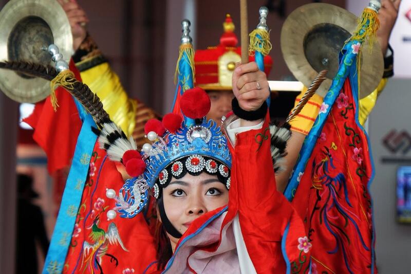 Above, dancers on opening day of the China Trade Week exhibition at Adnec. China is now the UAE’s No 2 trade partner after India, despite the bilateral trade volume declining last year by 11.5 per cent. Delores Johnson / The National