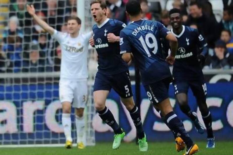 Jan Vertonghen shows his Tottenham teammates where the 'S' would be on his shirt after his super play against Swansea.