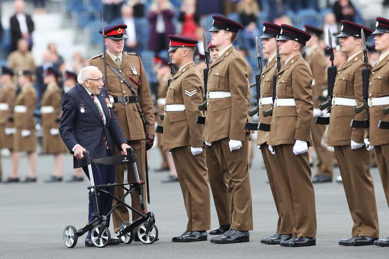 Captain Sir Tom Moore, in the role of Chief Inspecting Officer, inspects junior soldiers at their graduation parade during a visit to the Army Foundation College in Harrogate, England. AP Photo