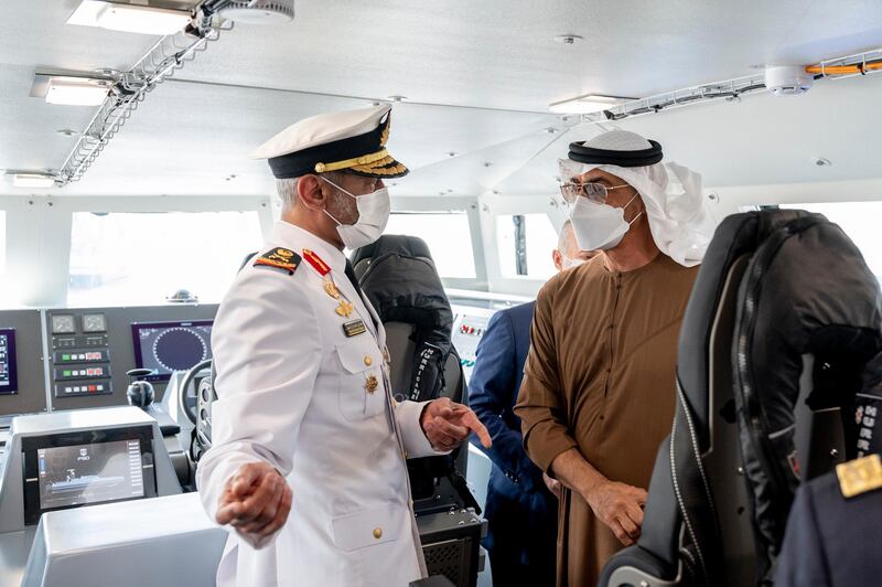 ABU DHABI, UNITED ARAB EMIRATES - February 23, 2021: Rear Admiral Pilot HH Sheikh Saeed bin Hamdan bin Mohamed Al Nahyan, Commander of the UAE Naval Forces (L) speaks with HH Sheikh Mohamed bin Zayed Al Nahyan, Crown Prince of Abu Dhabi and Deputy Supreme Commander of the UAE Armed Forces (R), during a tour at the 2021 Naval Defence and Maritime Security Exhibition (NAVDEX), at ADNEC. 

( Hamad Al Kaabi / Ministry of Presidential Affairs )​
---