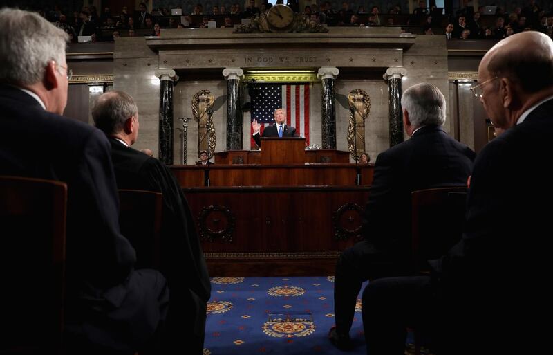 U.S. President Donald Trump, center, delivers a State of the Union address to a joint session of Congress at the U.S. Capitol in Washington, D.C., U.S., on Tuesday, Jan. 30, 2018. Trump sought to connect his presidency to the nation's prosperity in his first State of the Union address, arguing that the U.S. has arrived at a "new American moment" of wealth and opportunity. Photographer: Win McNamee/Pool via Bloomberg