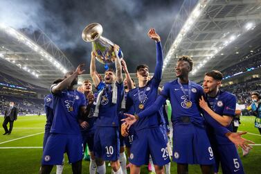 Christian Pulisic of Chelsea celebrates with the Champions League trophy with teammates Antonio Ruediger, Kai Havertz and Tammy Abraham following their victory against Manchester City. Getty