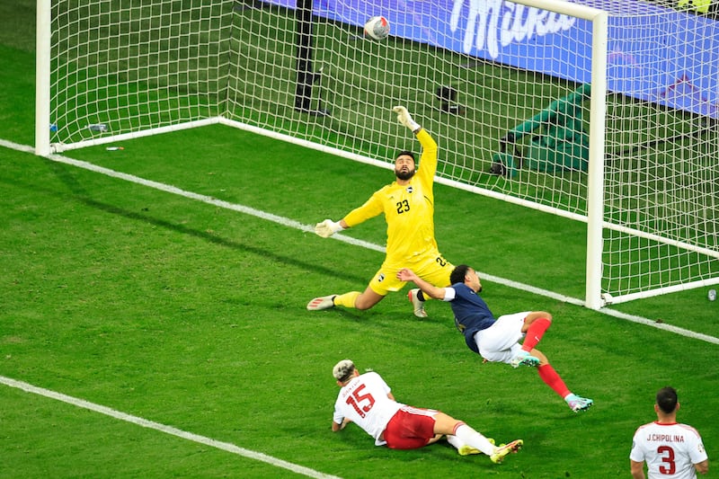 France midfielder Warren Zaire-Emery scores the third goal before going off injured. AFP