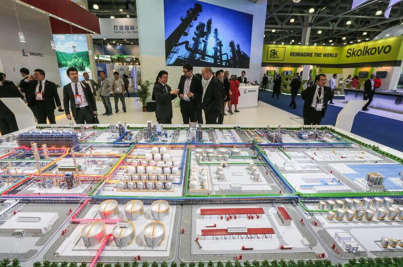 A China Petroleum and Chemical Corporation exhibit at the 21st World Petroleum Congress in Moscow shows a layout of an oil refining facility. Sergei Ilnitsky / EPA