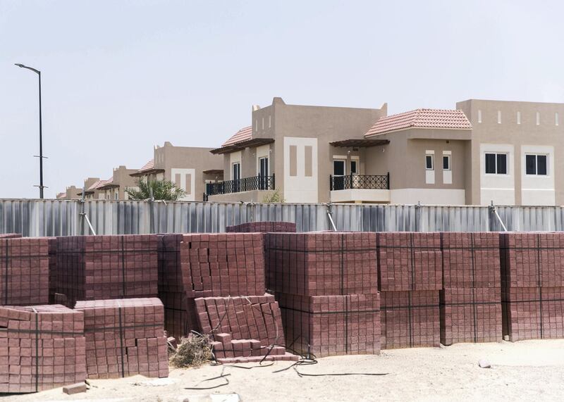 DUBAI, UNITED ARAB EMIRATES - JULY 15 2019.

Ungated construction sites around the neighborhood at Living Legends.

Some residents and investors of Living Legends have paid Dh6m for villas, and pay Dh25,000 a year in service charges but the development still looks like a construction site, with an unfinished golf course, roads, open sewer works near the school, poor lighting and no desert boundary meaning dangerous snakes and animals are regularly getting into the gardens and villas. 

(Photo by Reem Mohammed/The National)

Reporter: NICK WEBSTER
Section: NA