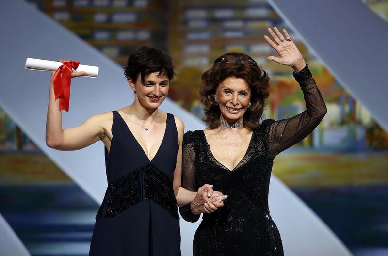 Director Alice Rohrwacher, Grand Prix award winner for her film Le meraviglie (The Wonders), poses on stage with actress Sophia Loren. Reuters