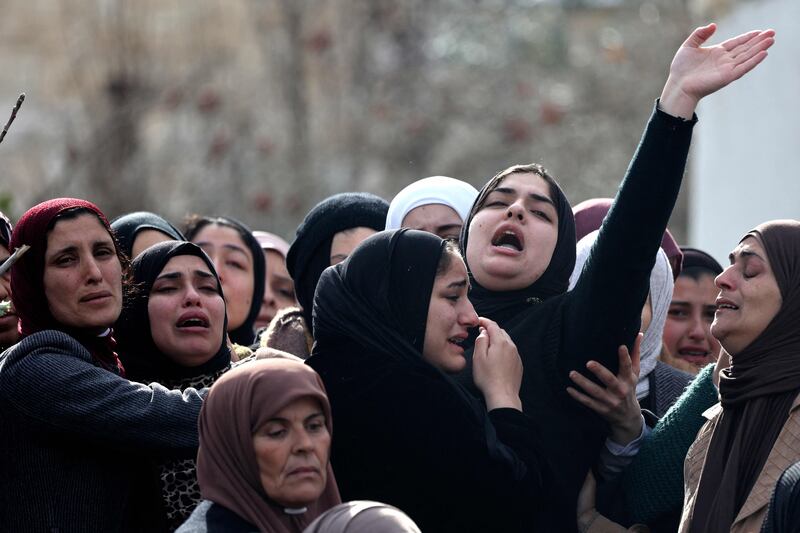 Palestinians mourn during the funeral of Abdulhadi Nazzal, who was killed in a raid by Israeli forces in Qabatia town,  in the occupied West Bank. AFP
