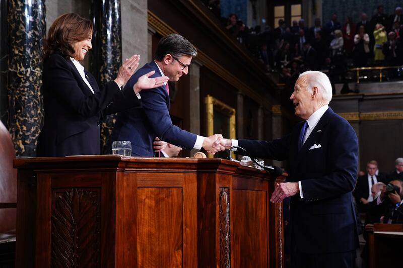 Mr Biden with House Speaker Mike Johnson and Vice President Kamala Harris, at the Capitol. AP