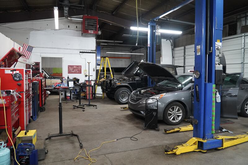 Cars waiting to be fixed in Michael Rodenhaber's garage. Willy Lowry / The National.