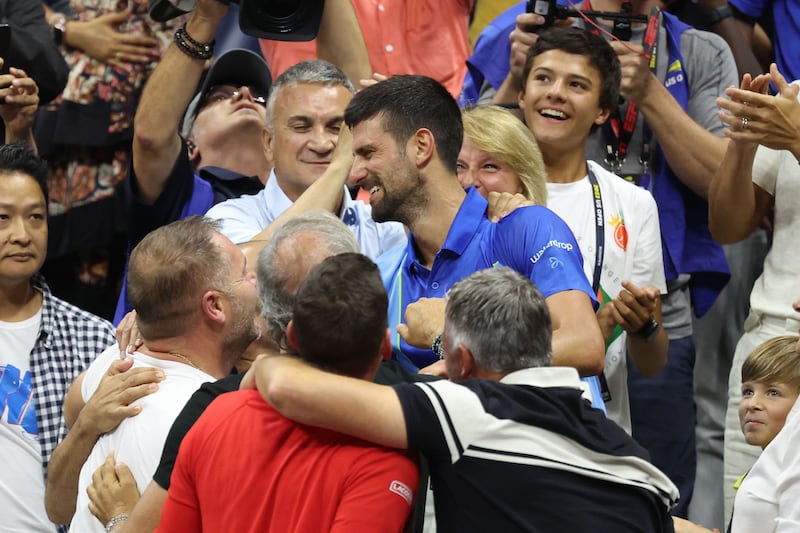Novak Djokovic celebrates with his family and team after winning the US Open. Getty