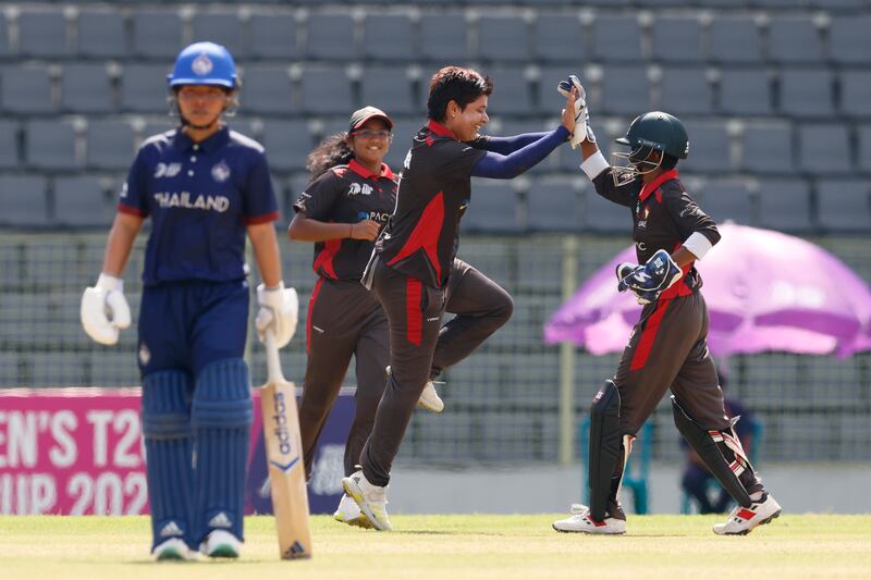 UAE captain Chaya Mughal and wicketkeeper Theertha Satish high-five after Sornnarin Tippoch was bowled. Courtesy ACC