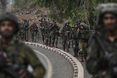 Israeli soldiers patrol at an undisclosed position in northern Israel near the border with Lebanon on Sunday. AFP