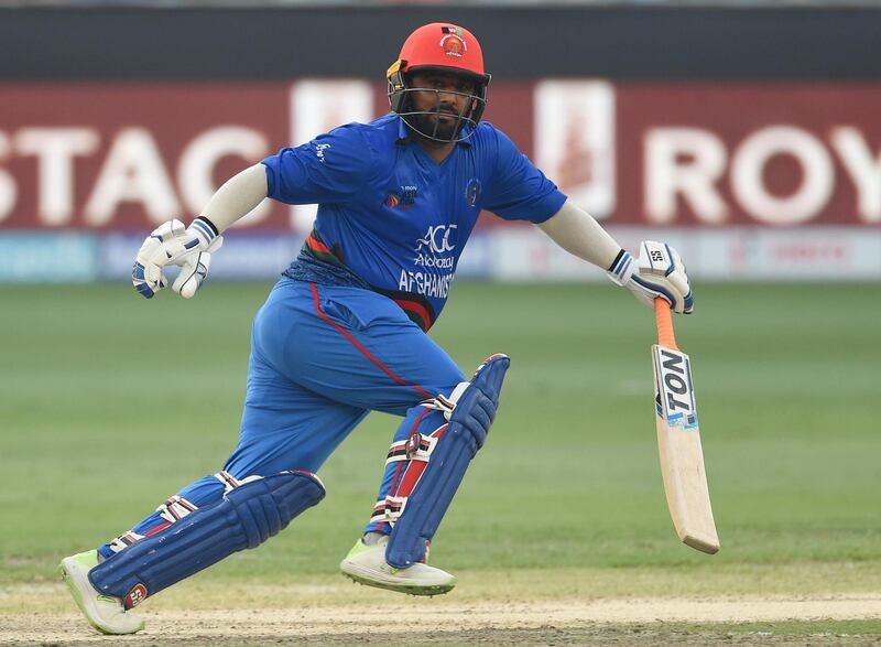 Afghan batsman Mohammad Shahzad runs between the wickets during the one day international (ODI) Asia Cup cricket match between Afghanistan and India at the Dubai International Cricket Stadium in Dubai on September 25, 2018. / AFP / ISHARA S. KODIKARA
