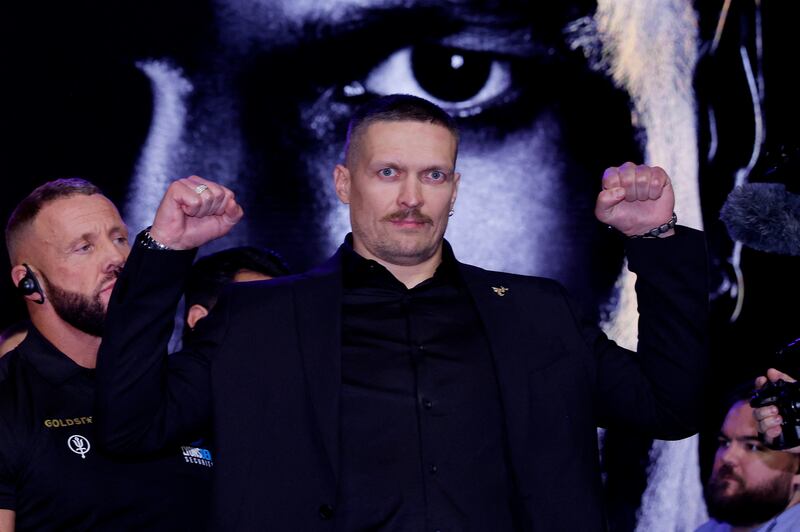 Oleksandr Usyk poses on the stage. Reuters 