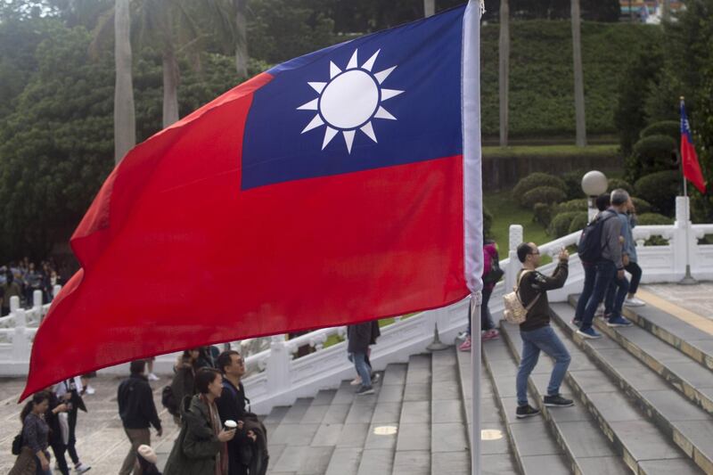 A Taiwan flag stands at the National Palace Museum in Taipei, Taiwan, on Friday, Dec. 29, 2017. Taiwan’s currency rose 18 percent in 2017, its best annual performance in three decades, largely the result of a weakening greenback. Photographer: Brent Lewin/Bloomberg