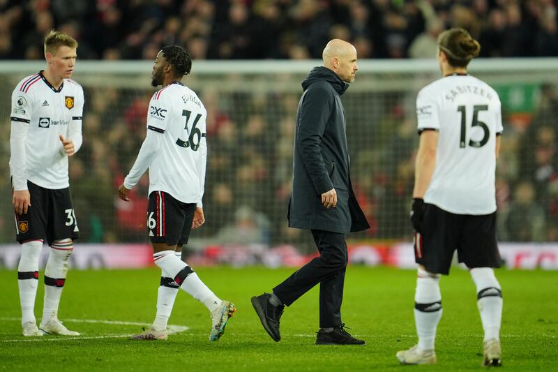 Manchester United coach Erik ten Hag leaves the pitch after the 7-0 defeat at Anfield. AP
