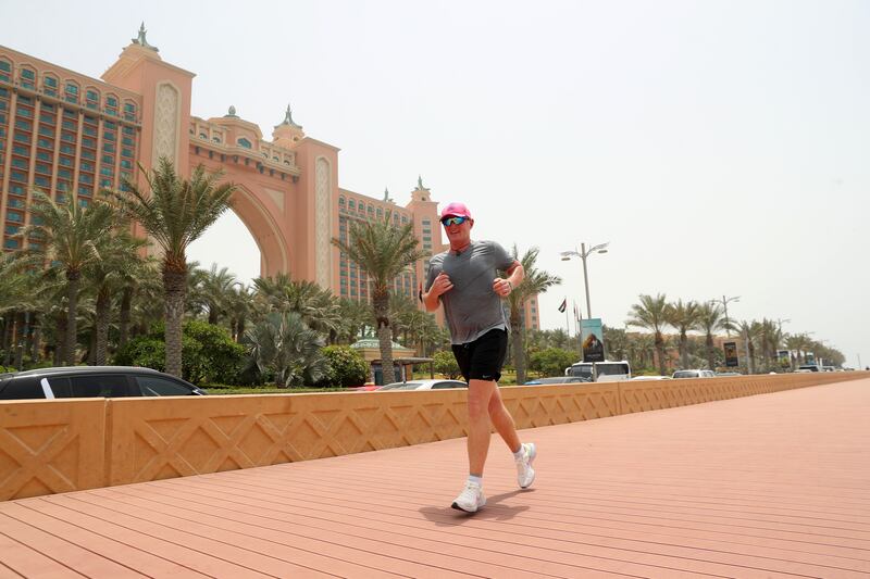 Former international cricketer Dougie Brown running round The Palm, Dubai at midday.