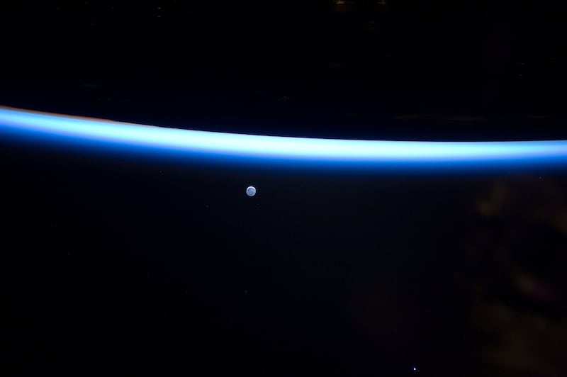 This image provided by NASA shows Earth's thin line of atmosphere and a gibbous moon are featured in this image photographed Sunday March 6, 2011 by an Expedition 26 crew member on the International Space Station. (AP Photo/NASA) *** Local Caption ***  NY117_Space_Shuttle.jpg