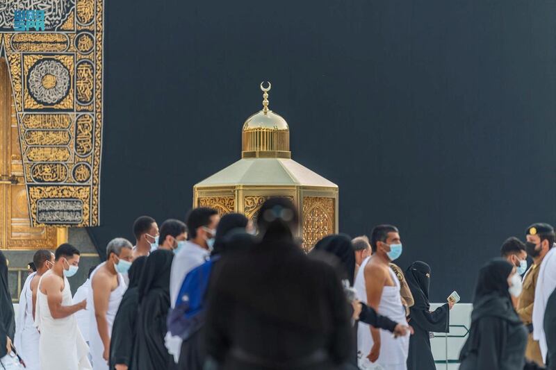 Pilgrims pass Maqam Ibrahim as they perform Umrah at the Grand Mosque in Makkah, Saudi Arabia. SPA