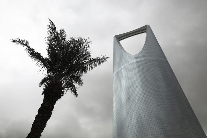 The Kingdom Tower, operated by Kingdom Holding Co., stands alongside palm tress in Riyadh, Saudi Arabia, on Saturday, Nov. 26, 2016. Saudi Arabia and the emirate of Abu Dhabi plan to more than double their production of petrochemicals to cash in on growing demand. Photographer: Simon Dawson/Bloomberg