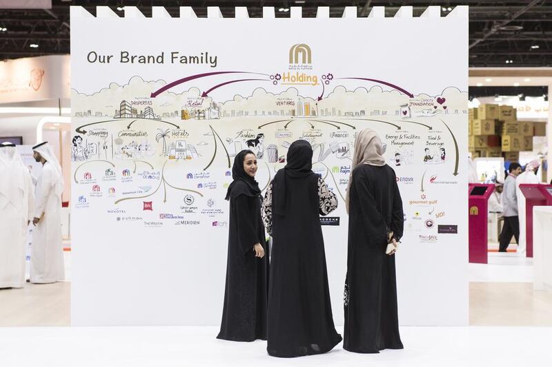 Young Emiratis attend a job fare. Reem Mohammed / The National