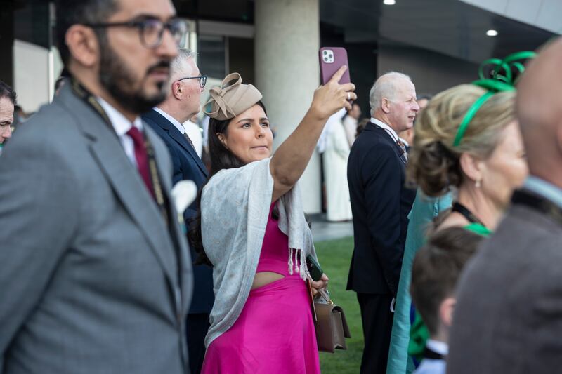 Suits, ties, hats and fascinators are a hallmark of the Dubai World Cup. Antonie Robertson / The National
