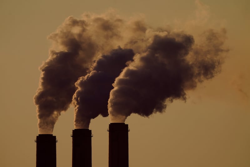 Emissions rise from the smokestacks at the Jeffrey Energy Center coal power plant near Emmett, Kansas. AP