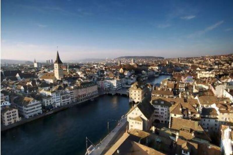 The view across the Limmat River and Zurich's old town from the top of Grossmunster Cathedral. Alamy
