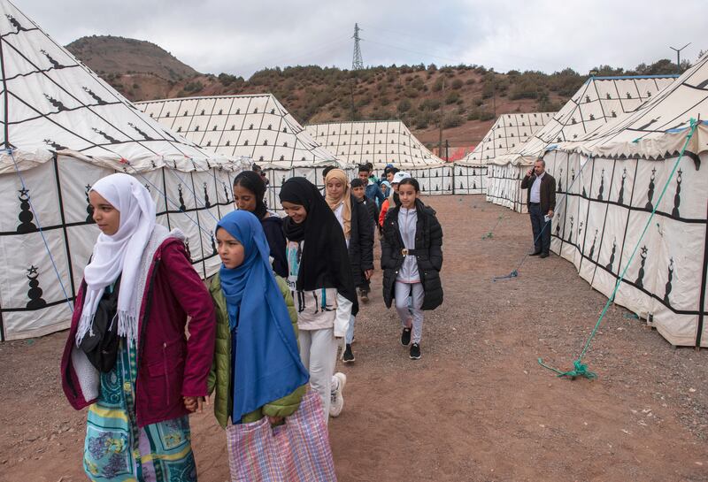 Children attend classes in a tent school prepared by the Moroccan army for pupils affected by the earthquake, in the village of Asni, south of Marrakesh. EPA