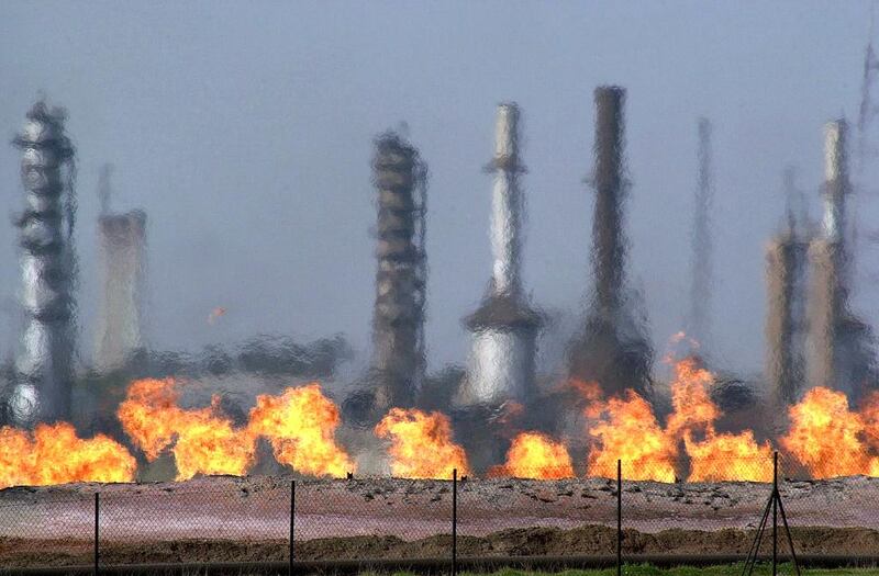 Fires flare off the gas from crude at an oil processing plant in the northern Iraqi town of Baba Gurgur, outside of Kirkuk. Khalid Mohammed / AP Photo