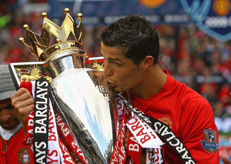 Cristiano Ronaldo lifts the Premier League trophy at Old Trafford in 2009