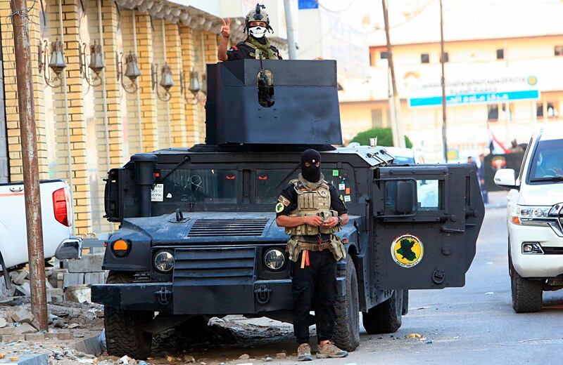 Security forces are seen in Basra. AP