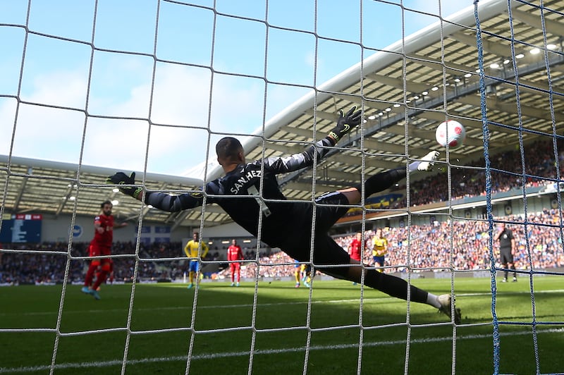Mohamad Salah scores from the spot for Liverpool. Getty