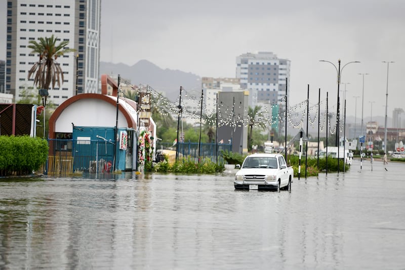 A vehicle stalled by heavy rain and floodwaters in Fujairah on Friday. Khushnum Bhandari / The National