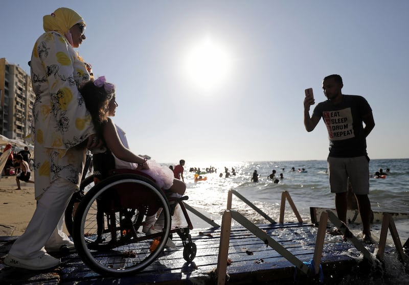 Wheelchair access at the beach means this man and his wife can take their daughter to the beach with confidence that the facilities are designed for the physically challenged.