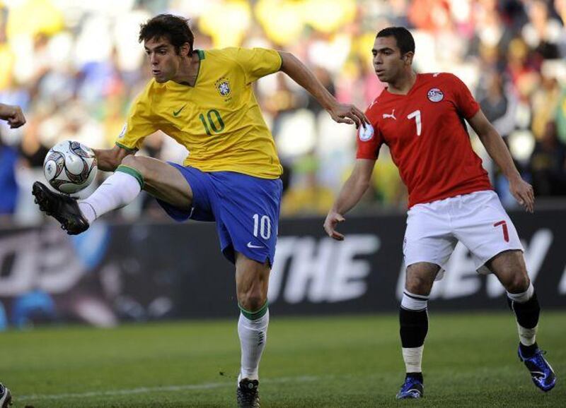 Kaka, left, controls the ball before scoring Brazil's first as Egypt's Ahmed Fathi watches yesterday.