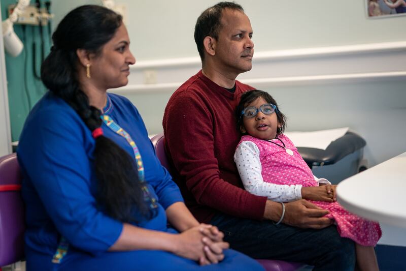 Aditi, 8, with father Uday and mother Divya during an appointment at the Great Ormond Street Hospital, London, on September 19. All photos by PA