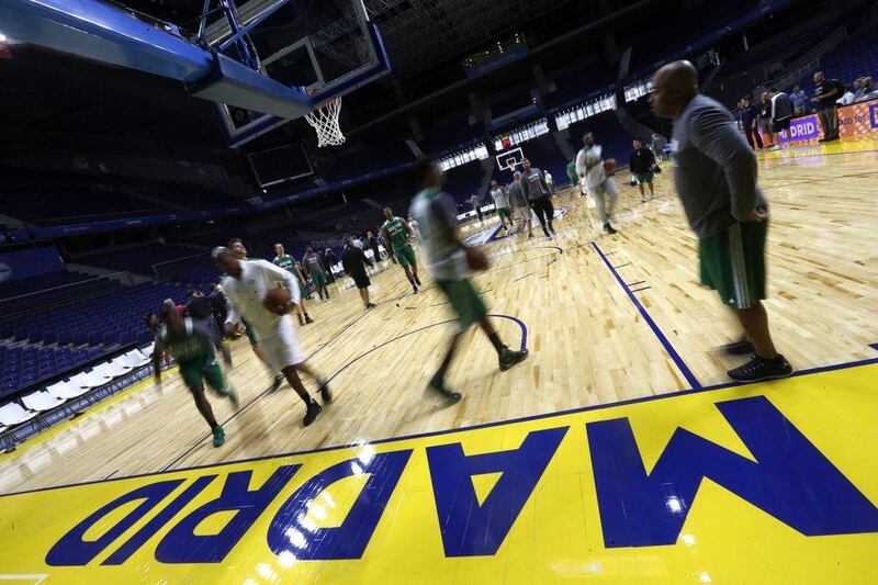 Boston Celtics players warm up at Real Madrid’s Palacio de los Deportes on Thursday night before their pre-season game against Madrid. Javier Lizon / EPA