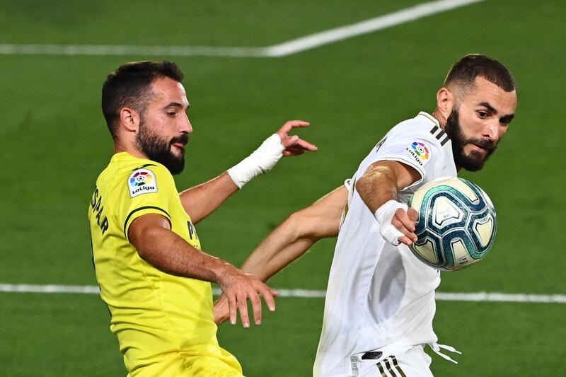 Villarreal's defender Mario Gaspar challenges Real Madrid's Karim Benzema. AFP