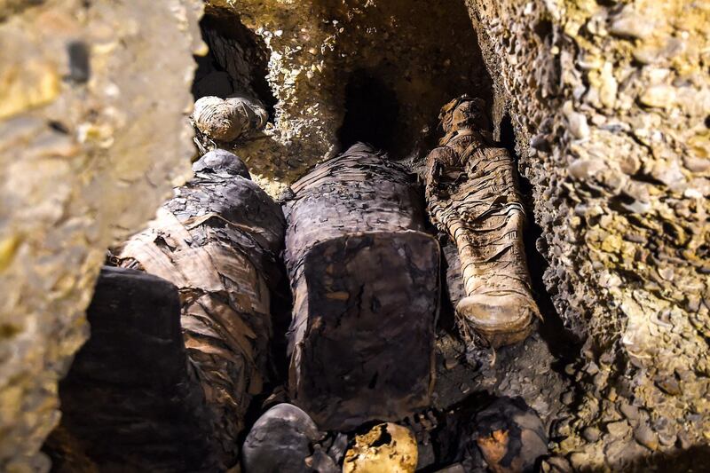 Newly-discovered mummies, wrapped in linen, were found in burial chambers at the necropolis of Tuna el-Gebel, Egypt. AFP