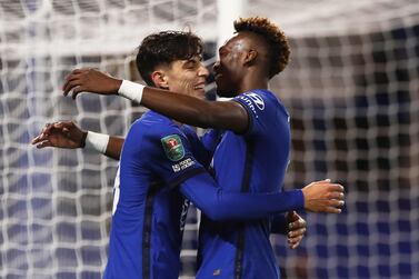 Kai Havertz celebrates with teammate Tammy Abraham after scoring the fifth goal against Barnsley for his own hat-trick. EPA