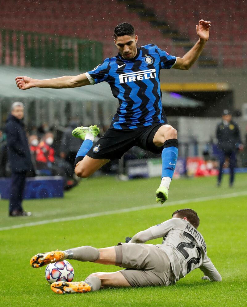 Inter Milan's Achraf Hakimi is tackled by Mykola Matviyenko of Shakhtar Donetsk. Reuters