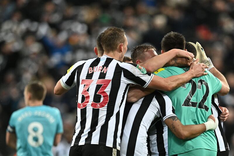 Newcastle players celebrate making the League Cup final. AFP